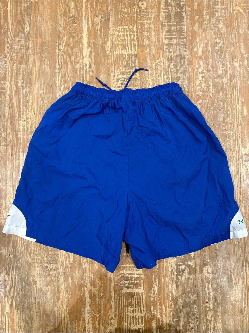 Nike Blue Athletic Shorts with White & Green Accents
